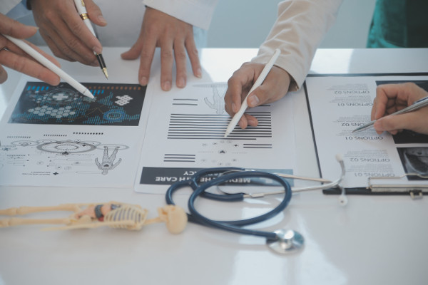 Doctors reviewing documents in a medical office